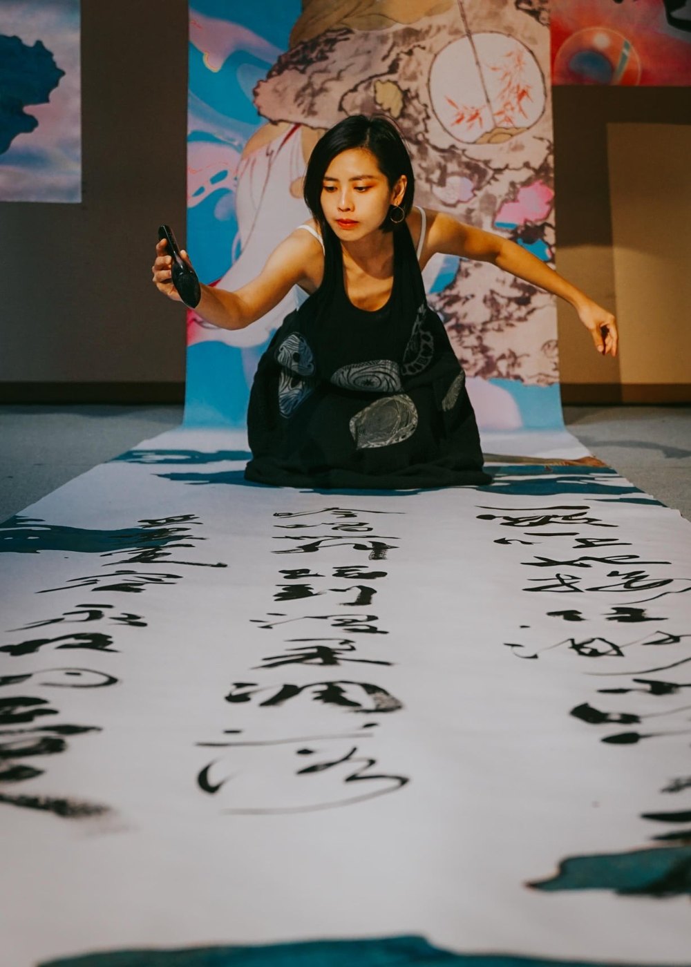 Rae Hsu performing calligraphy